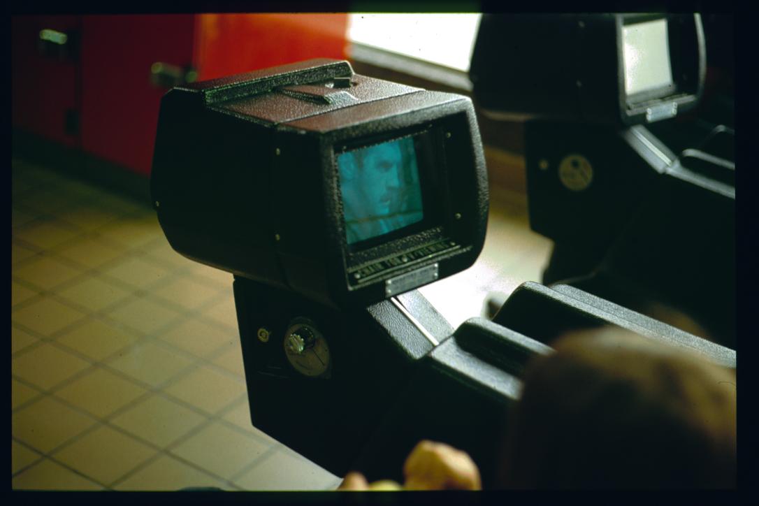 USA 1990/Augusta, GA/Greyhound station waiting room/coin-operated tv set in chair/